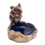 A Royal Doulton stoneware mouse pin tray in the manner of George Tinworth: the mouse sitting on the