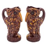 A pair of Longpark (Torquay) grotesque bird jugs: modelled standing with beak on chest,