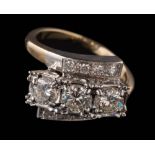 An illusion-set diamond cross-over ring: the three principal,