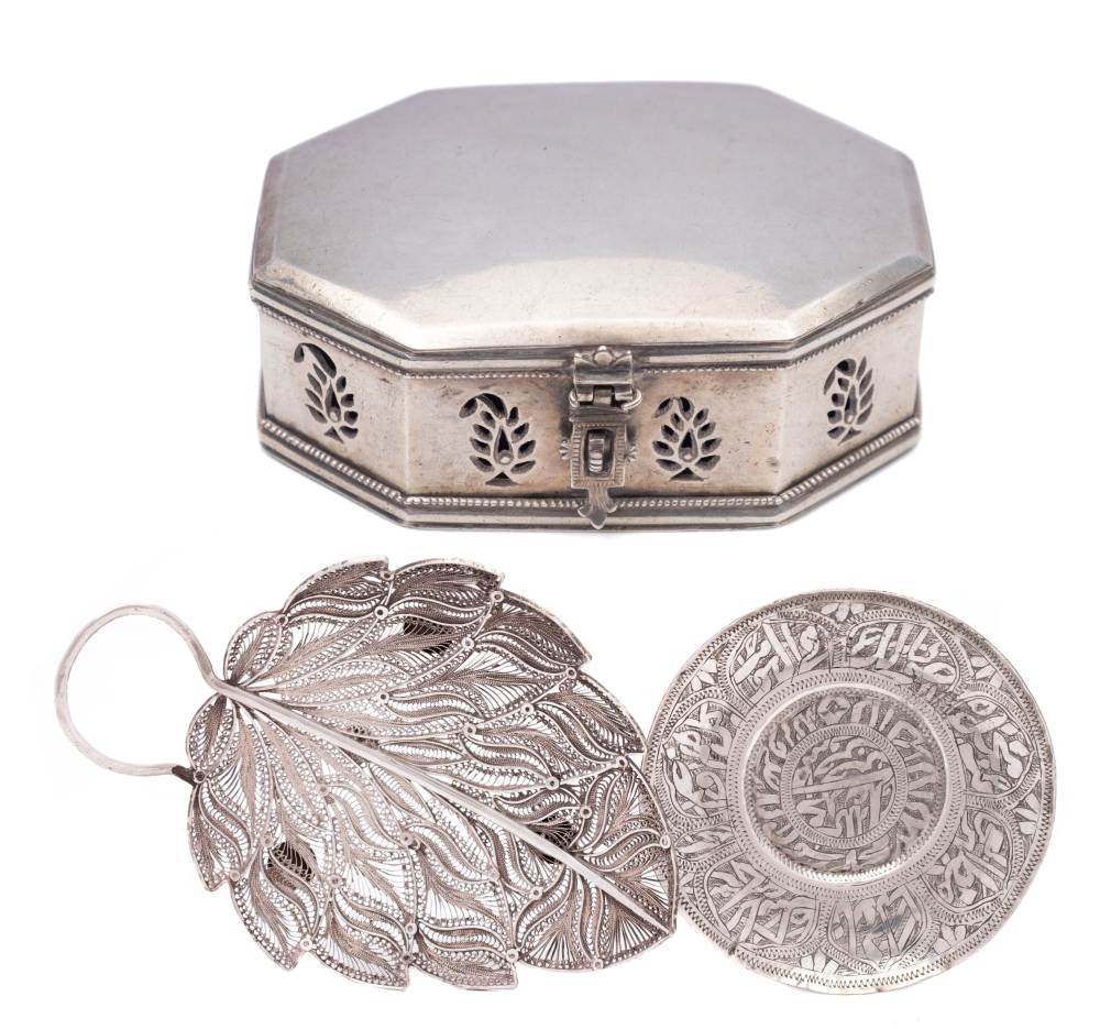 A silver filigree leaf-shaped dish: 15cm. long, an Indo-Persian silver dish, 10cm.