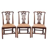 A set of six carved mahogany dining chairs in the Chippendale taste:,