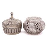 An Indian white metal circular box and cover: with knopped spire-shaped finial and lobed foliate