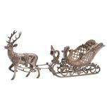 A Continental silver model of a reindeer pulling a sleigh,
