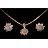 A star sapphire and diamond mounted 'star-burst' pendant on box-link chain and a pair of similar