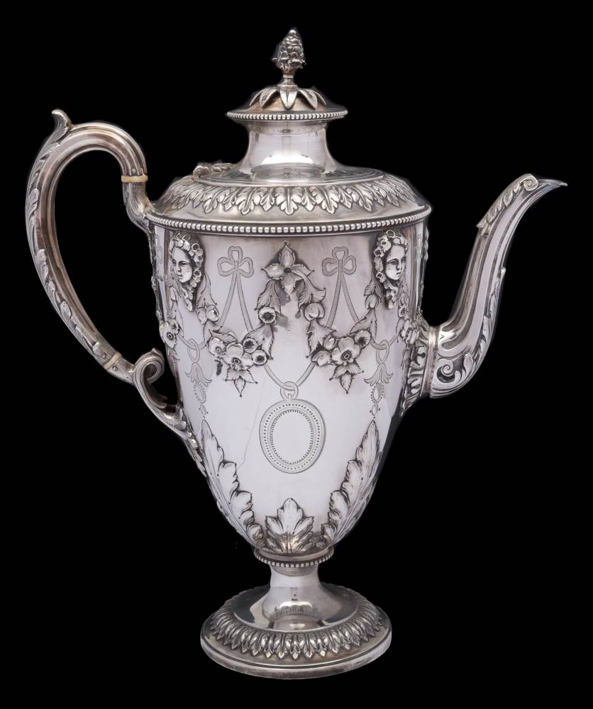 A Victorian silver coffee pot, maker Richard Martin & Ebenezer Hall, Sheffield, 1865: of ovoid form,