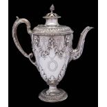 A Victorian silver coffee pot, maker Richard Martin & Ebenezer Hall, Sheffield, 1865: of ovoid form,