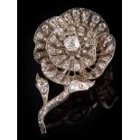 A Victorian diamond rose flower brooch: designed as a single bloom,