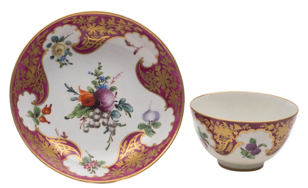 A First Period Worcester teabowl and saucer: painted in 'Hope Edwards' style with a bunch and