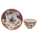 A First Period Worcester teabowl and saucer: painted in 'Hope Edwards' style with a bunch and