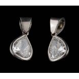 A pair of platinum and diamond pear-shaped drop pendants: each with a pear-shaped diamond