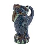 A Longpark (Torquay) grotesque bird jug: modelled standing with beak on chest,