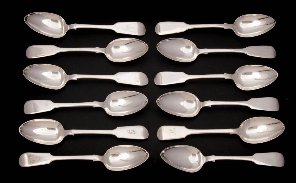 A collection of twelve silver Fiddle pattern dessert spoons,