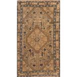 A Karabagh rug: the beige hexagonal field with a central hexagonal medallion,