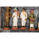 A collection of twenty four Indian Raj plaster and terracotta educational figures: depicting