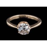 A diamond single-stone ring: the round old brilliant-cut diamond approximately 5.9mm diameter x 3.