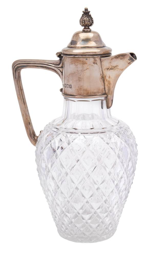 An Edward VII clear glass and silver mounted claret jug, maker Mappin & Webb, London,