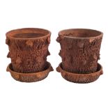 A pair of terracotta rustic garden tubs and stands:, of tree like form, 36cm (1ft 2in) high,