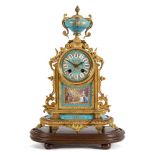 A 19th century French gilt-metal and porcelain mantel clock: the eight-day duration movement
