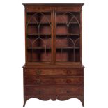 A 19th Century mahogany and inlaid bookcase:, bordered with boxwood and ebony lines,