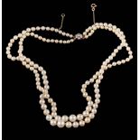 A graduated cultured pearl two-string necklace: with strings composed of 73 and 74 cultured pearls