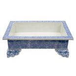 A large Japanese blue and white rectangular jardiniere: painted with a key pattern to the flattened