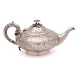 A Victorian silver teapot , maker Charles Lias, London, 1847: of squat circular form,