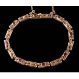 An amethyst and seed pearl bracelet: with attached safety chain, the clasp stamped '9ct V & C',