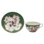 A First Period Worcester 'spotted fruit' teacup and saucer: painted with a variety of fruit and