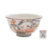 An early Meissen kakiemon teabowl: painted with a banded hedge and the 'Three Friends' of pine,