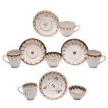 A group of New Hall hardpaste spiral fluted and reeded tea and coffee wares: painted and gilded