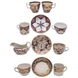 A group of New Hall hardpaste and bone china tea and coffee wares: in underglaze blue and gilt tree