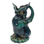A Longpark (Torquay) pottery grotesque dragon ewer: modelled in the form of a seated beast with