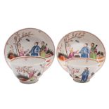 A pair of New Hall famille rose hardpaste teabowls and saucers: each painted with a garden scene