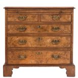 A walnut veneer and feather banded rectangular chest: of small size in the early 18th Century taste,