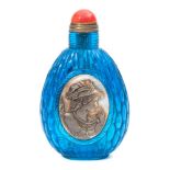A Chinese Peking blue glass snuff bottle: of ovoid form with beaded woven design,