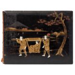 A Japanese lacquered photograph album: the front board decorated with a figure in a sedan chair