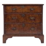 An 18th century walnut and crossbanded rectangular chest:, of comparatively small size,