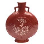 A Chinese coral ground moon flask: the short branch handles with ruyi-head terminals,