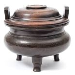 A small Chinese silver inlaid bronze tripod censer and wood cover: with flattened angular loop