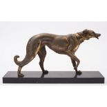 After Irenee Rochard, an Art Deco spelter figure of a dog:, raise on a black slate plinth,