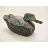 A carved wood and painted duck:, 24cm high.