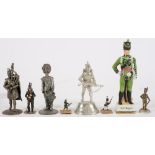 A group of seven various pewter and other metal figures of soldiers: and a ceramic example (8).