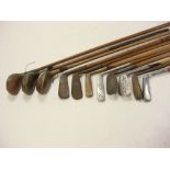 A group of early 20th century golf clubs:, including R G Pilch iron, J B Jolly putter,