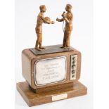 A gilt metal and wooden 'Soccer TV Personality of The Year' trophy for Kenneth Wolstenhome:,