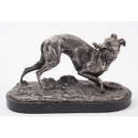After Mene, a spelter model of a greyhound with a riding whip in its mouth:, on an ebony base,