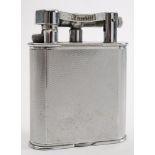 A Dunhill silver plated petrol table lighter:, signed as per title to arm, on an engine milled case,