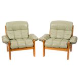 A set of four teak and green leather Ekornes Stressless 'Montana' armchairs by J E Ekornes,
