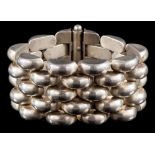 A mid 20th century Continental silver 'Tank' bracelet: with a wide band of polished domed links,