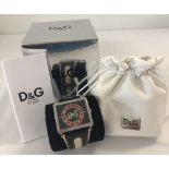 A men's Dolce & Gabbana wristwatch with pouch and box.