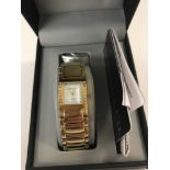 A boxed Diamond & Co ladies gold tone bracelet watch.